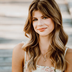 Hayley Isabel performing live — Alberta teen singer-songwriter blending heartfelt storytelling with 90s rock energy.