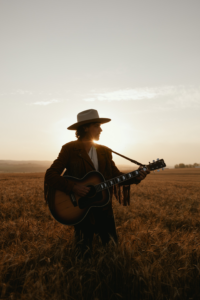 Matt Blais live performance Canadian roots rock singer songwriter with harmonica on stage
